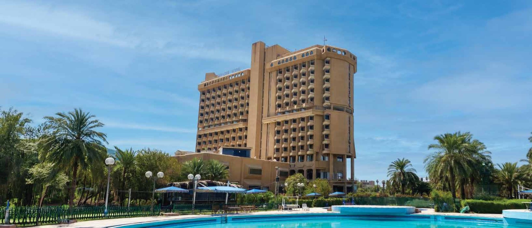 Melia Almansour Hotel: the hotel, pool, and palm gardens on the Tigris